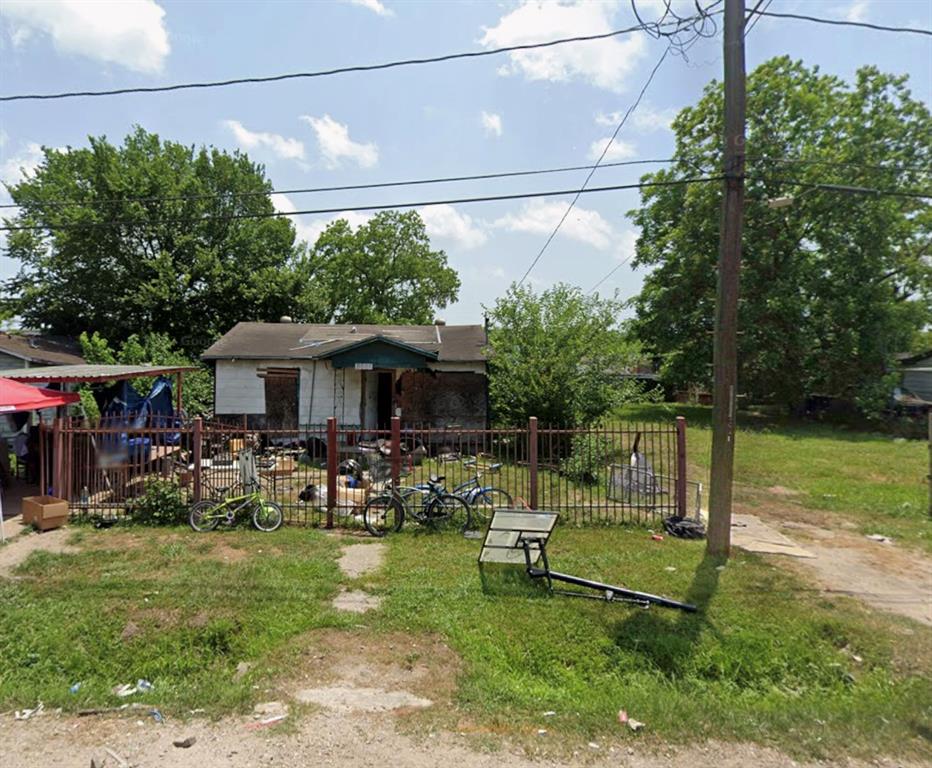 a view of a chairs and table in a yard