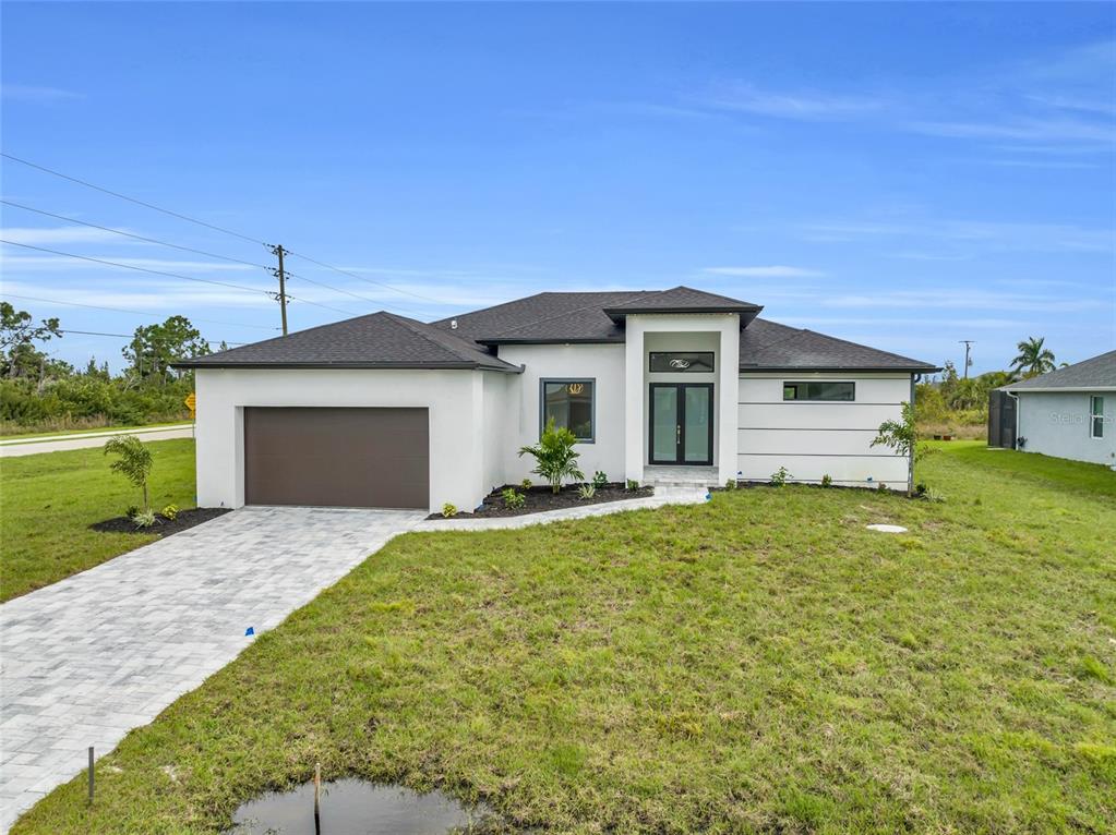 a front view of a house with a yard