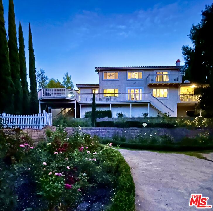 a house view with a garden space