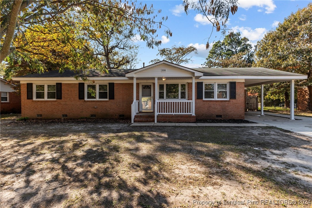 a house with trees in the background