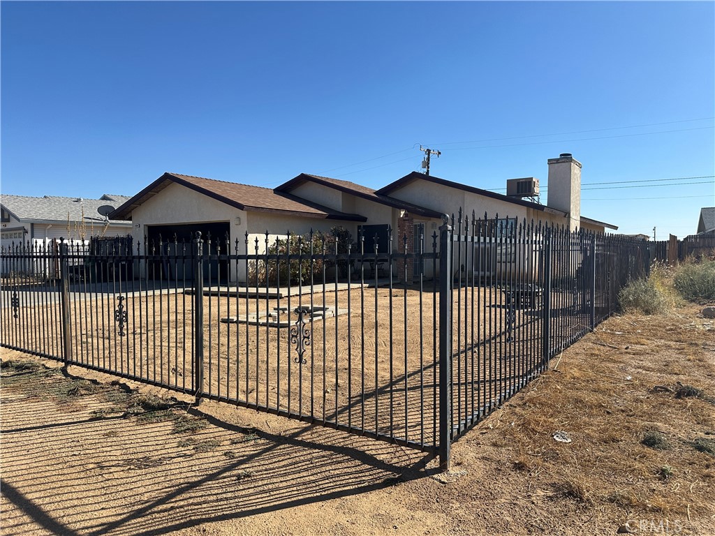 a view of a wrought iron fences in front of house