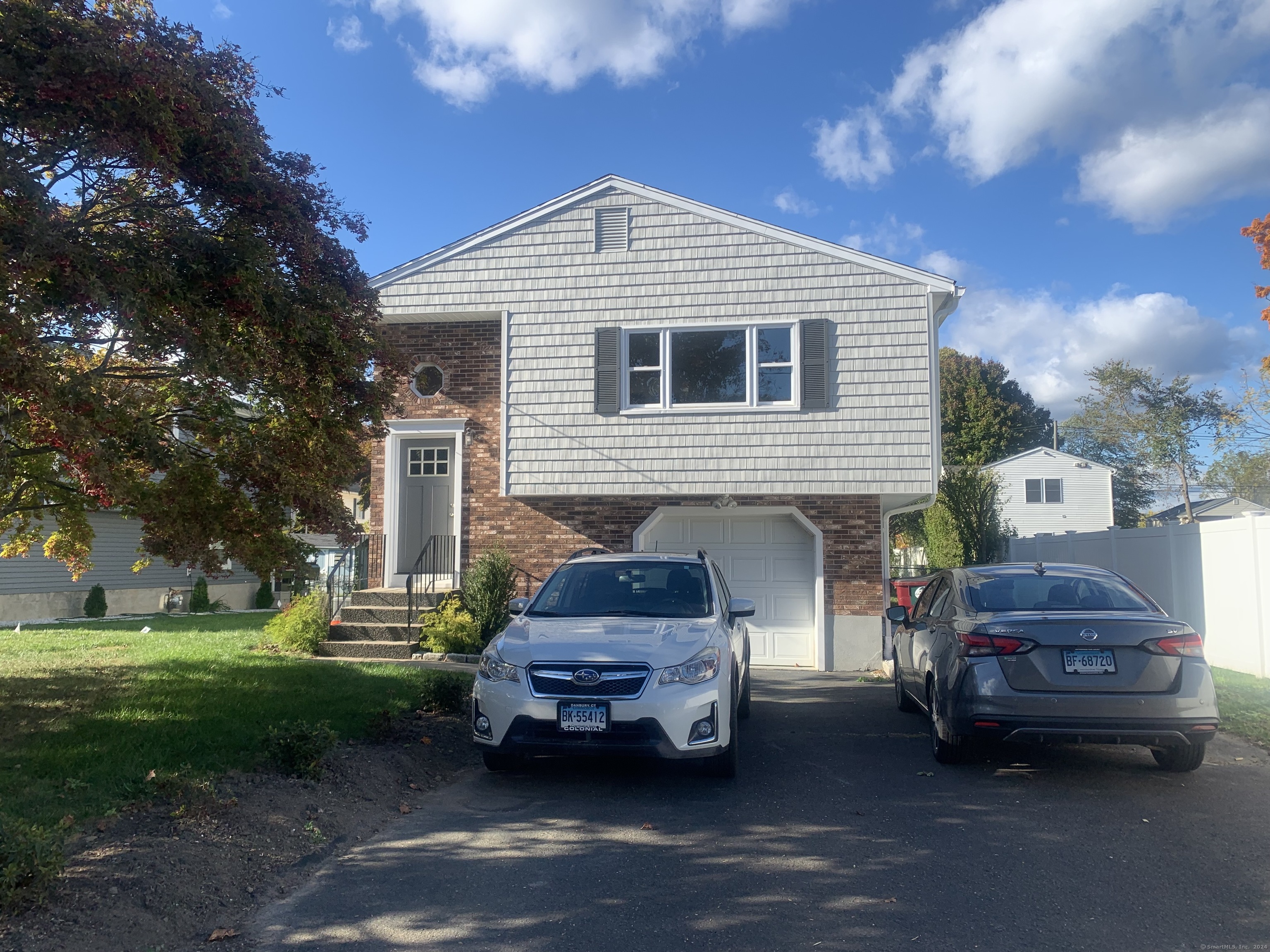 a car parked in front of a house