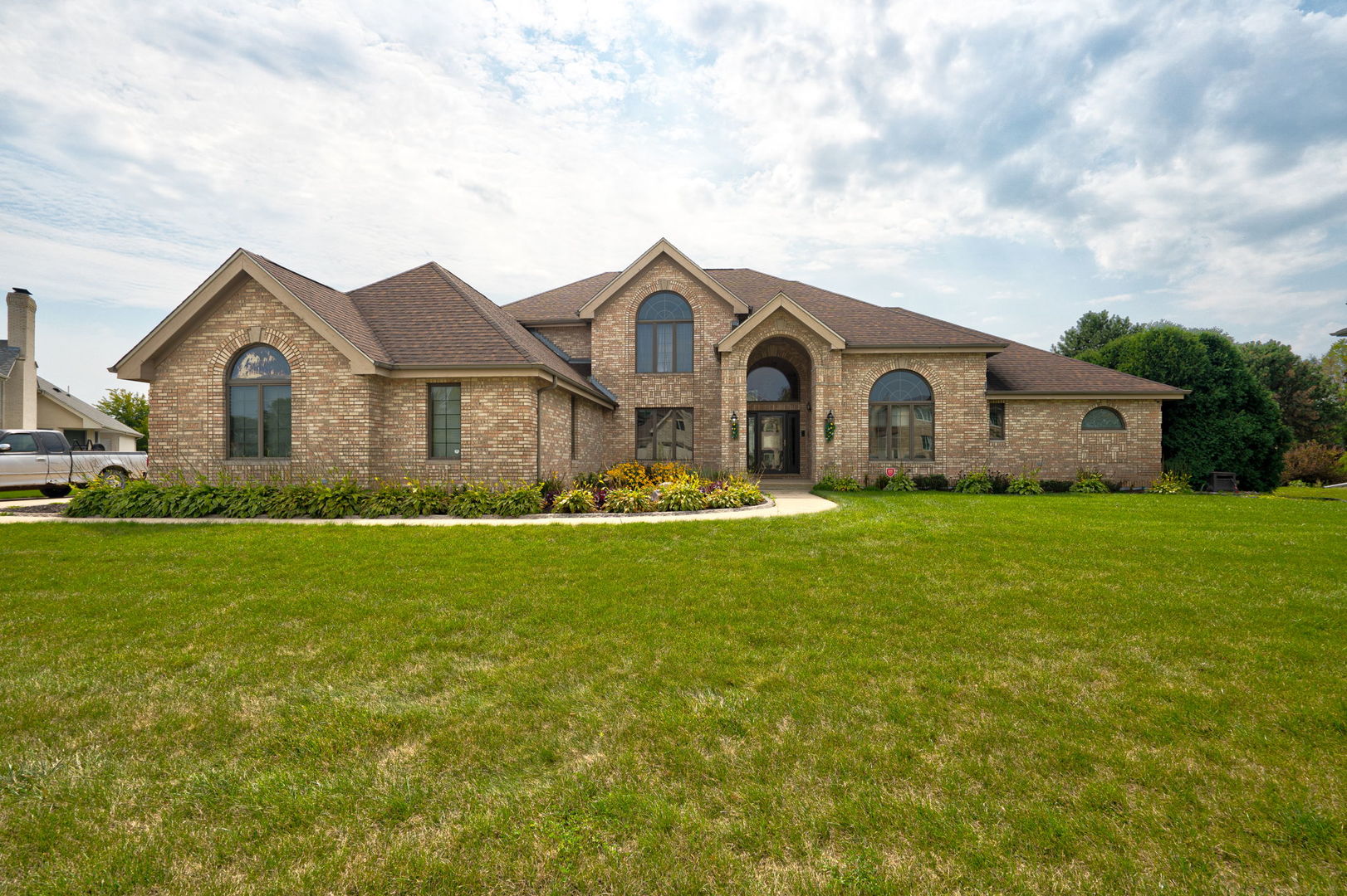 a front view of a house with garden