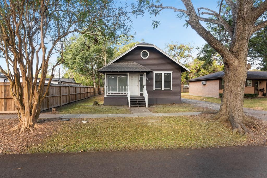 Charming single-story home featuring a covered front porch, spacious yard, and mature trees. This property combines vintage appeal with modern updates, making it a perfect space to settle into