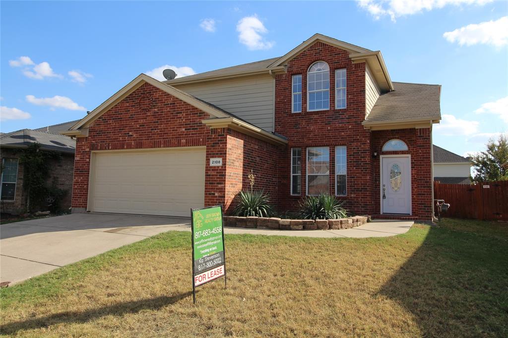 a front view of a house with yard