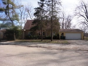 a house with trees in front of it