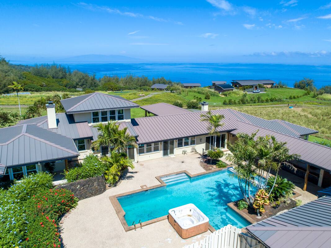 an aerial view of a house with a garden