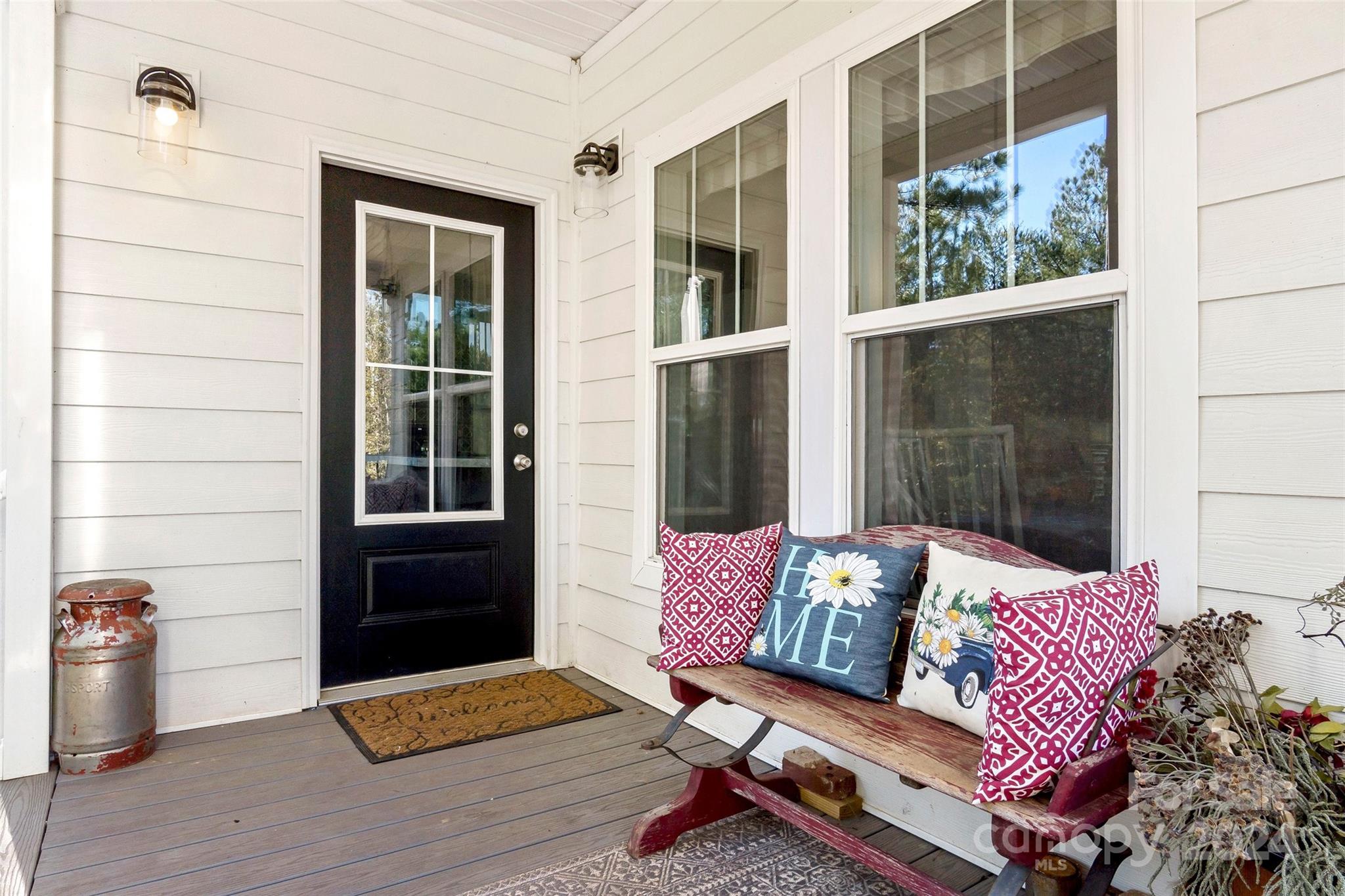 a outdoor living space with furniture and a potted plant