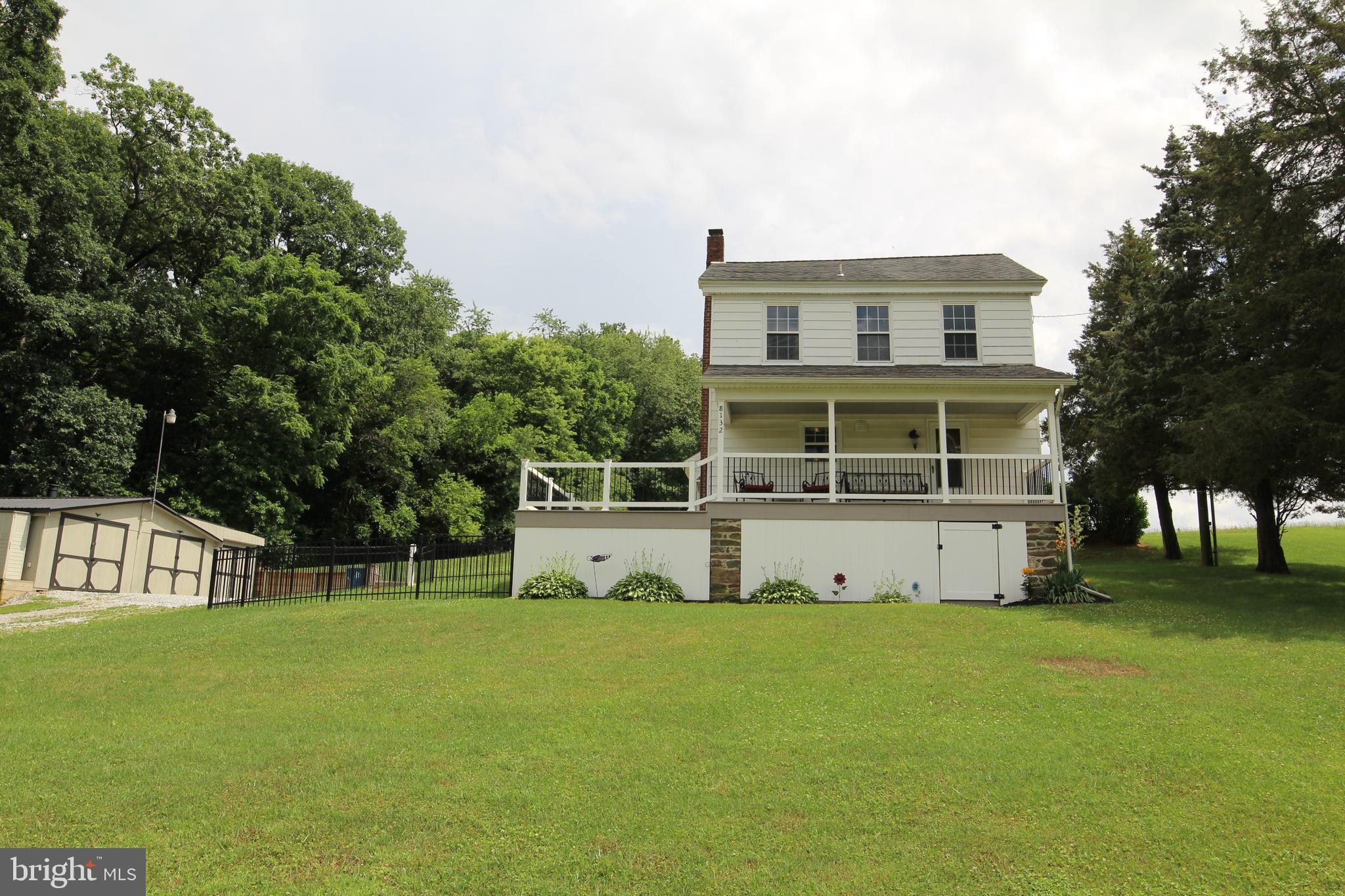 a view of house with a garden