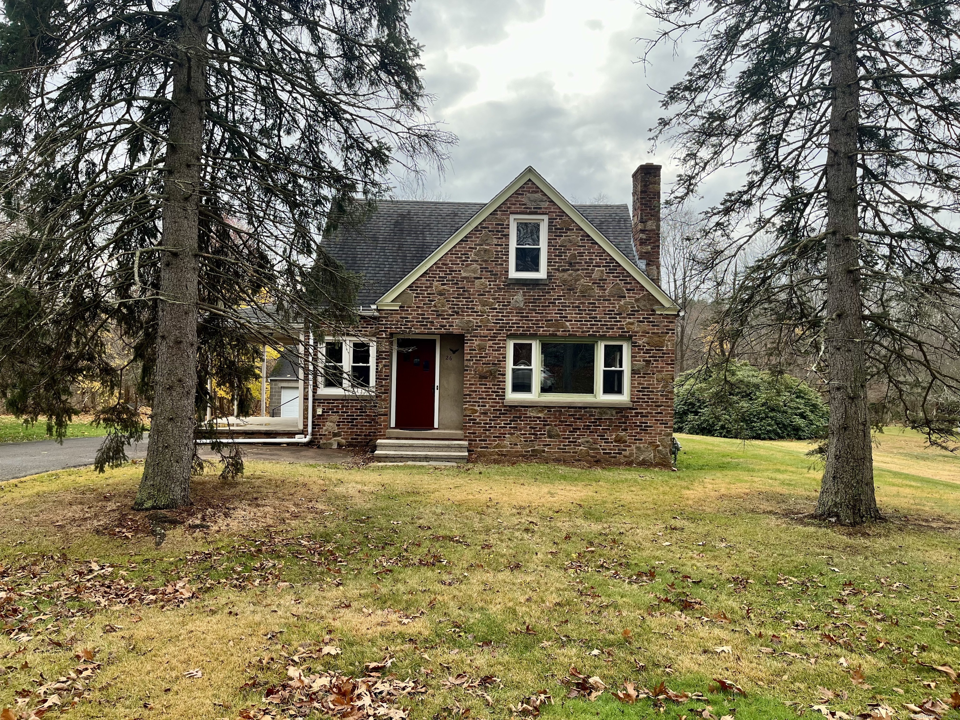 a front view of a house with a yard