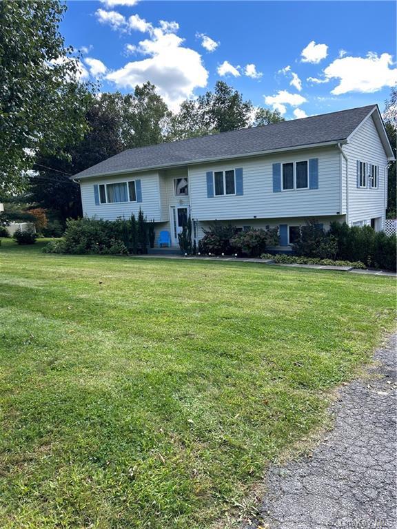 Bi-level home with a front yard