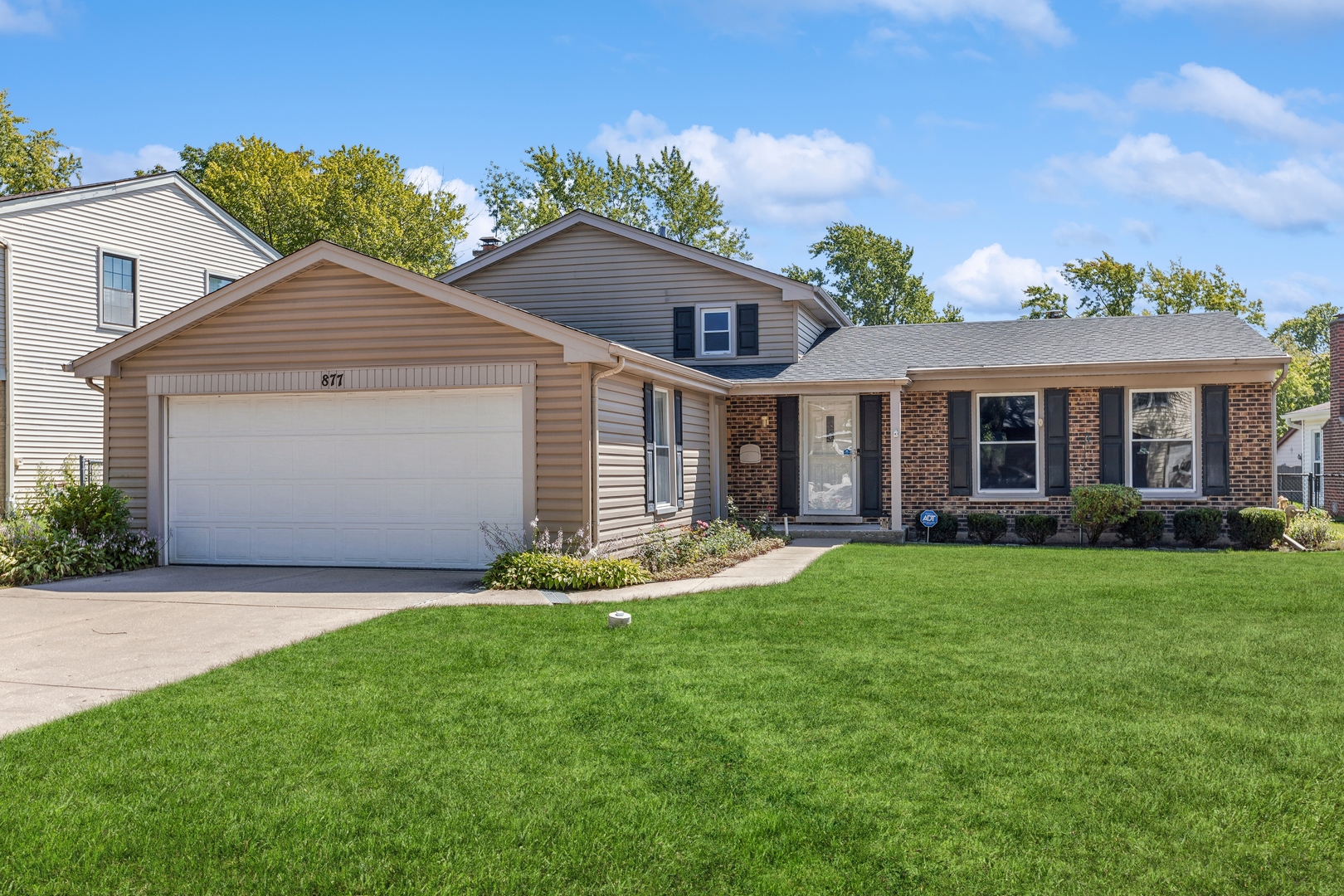 front view of a house with a yard