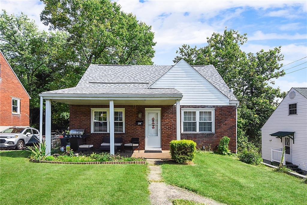 front view of a house with a yard