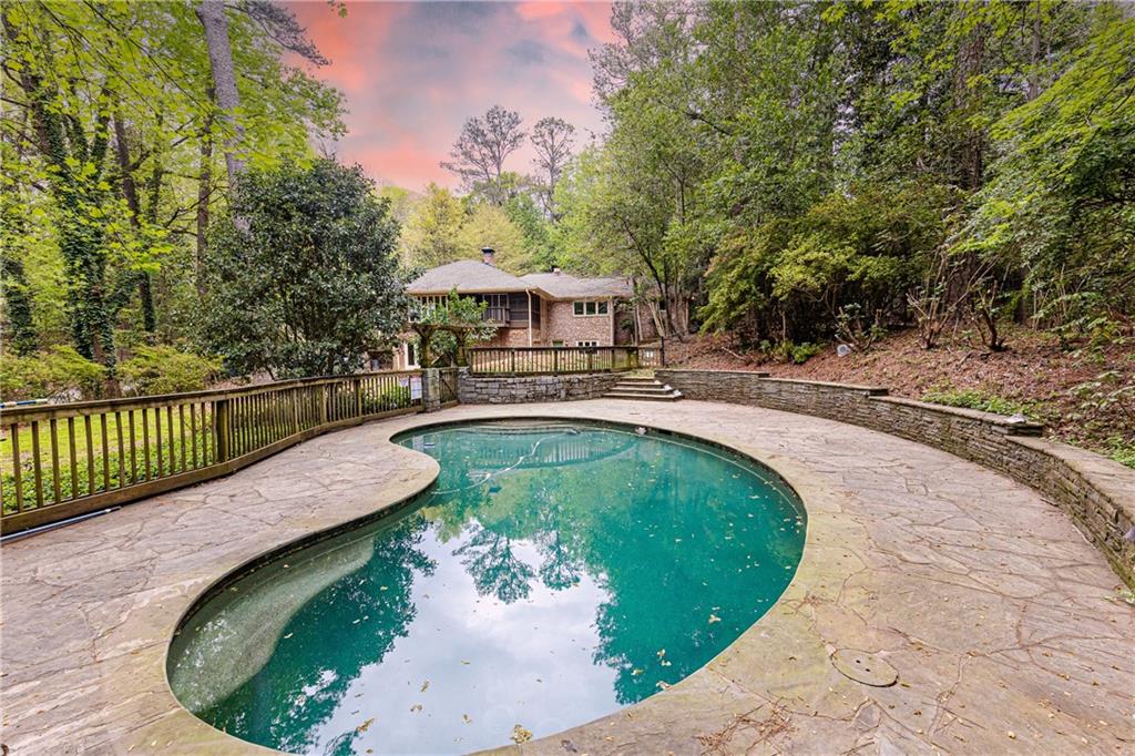 a view of a swimming pool with a patio