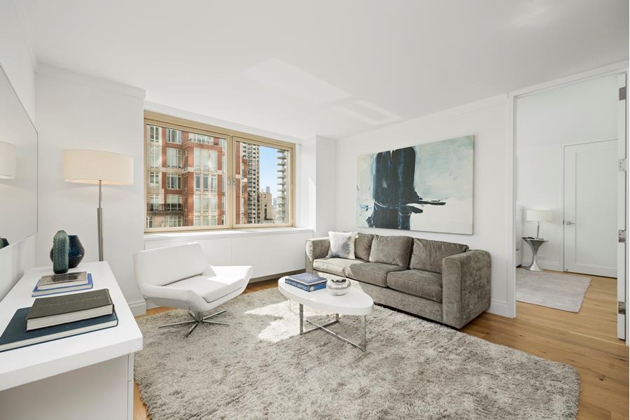 a living room with furniture and a window