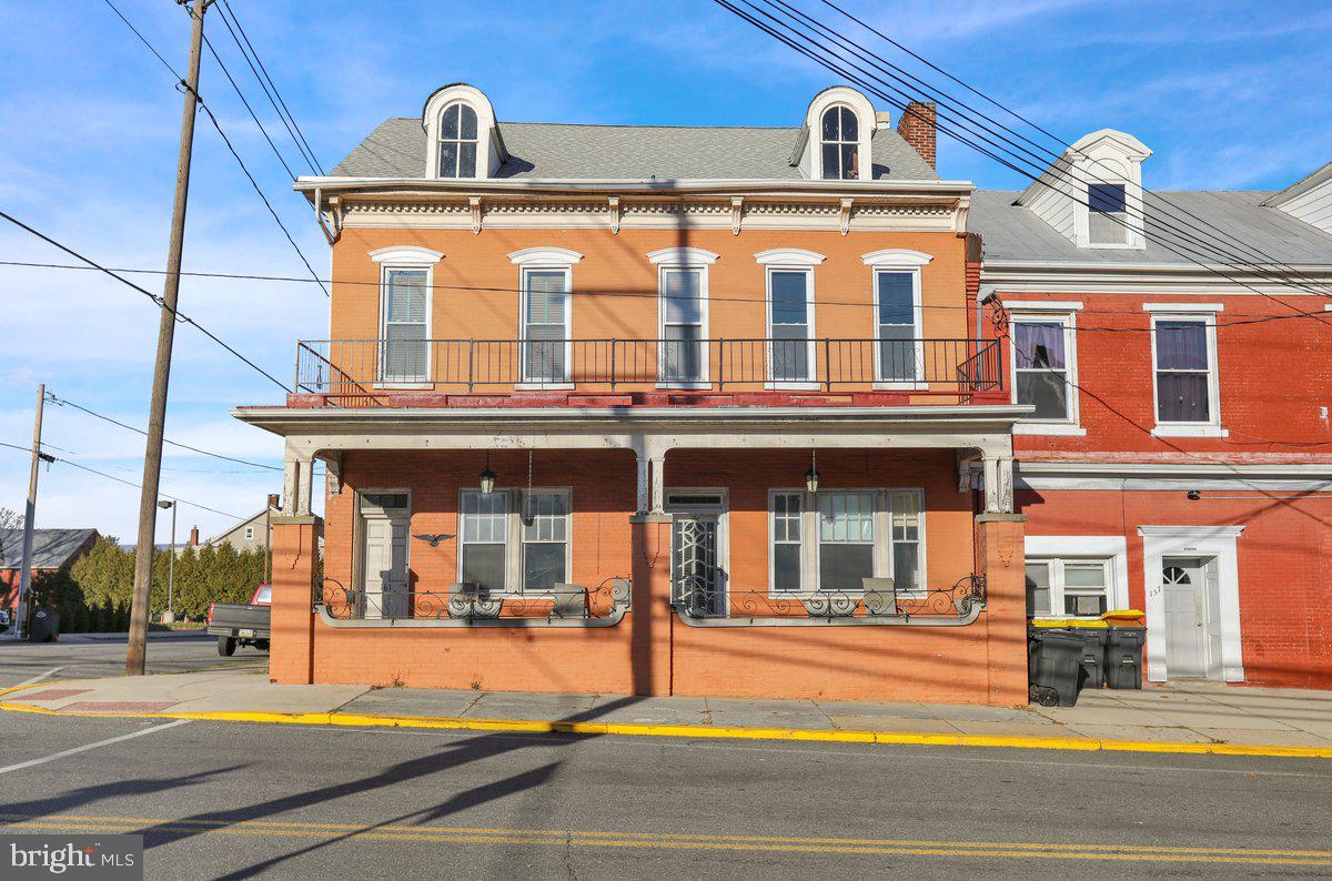 a view of a building with a porch