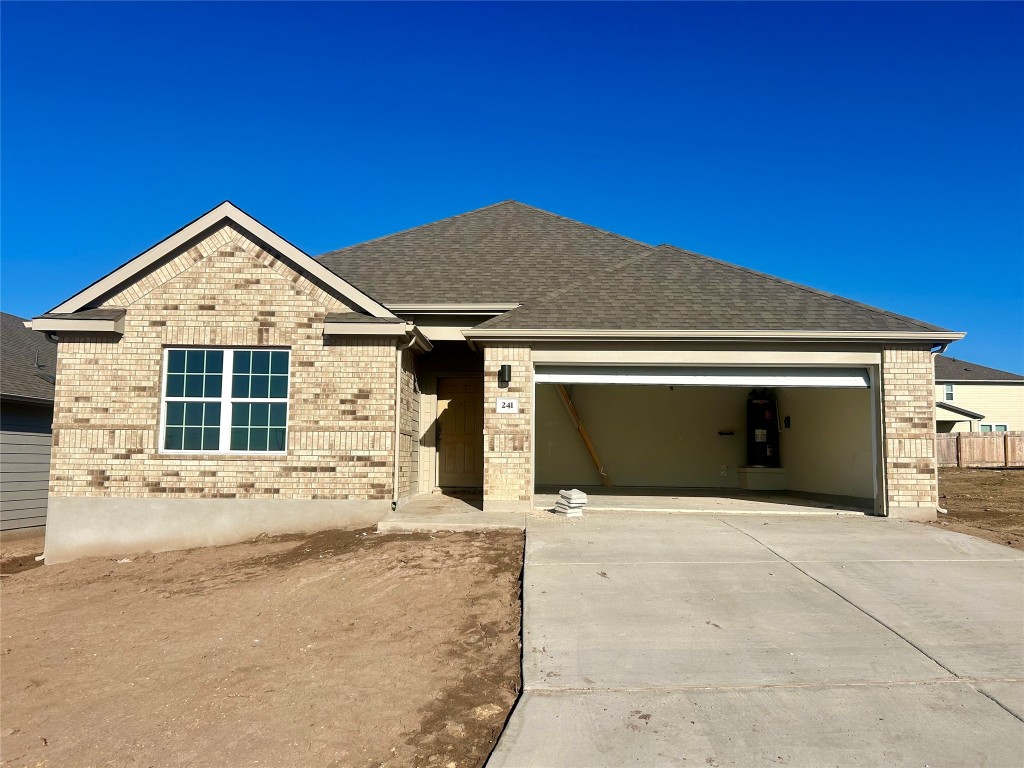 a front view of a house with a garage