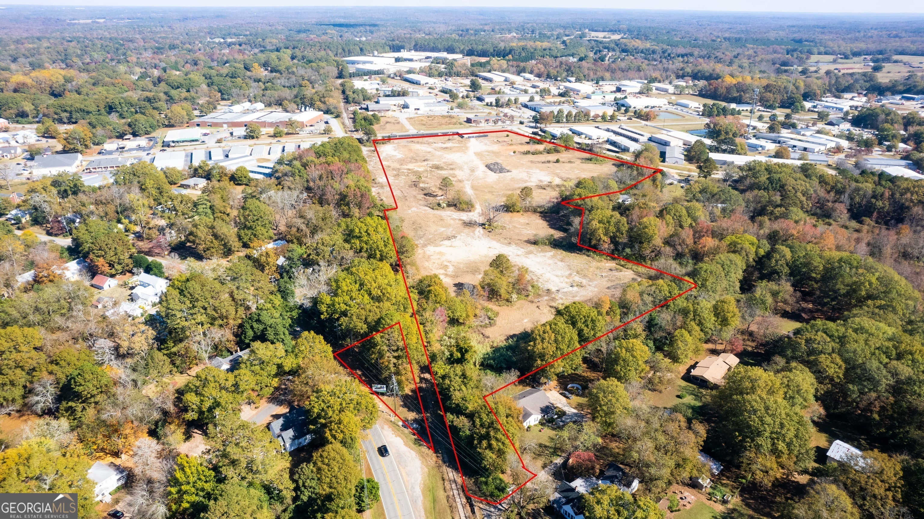 an aerial view of residential houses with outdoor space