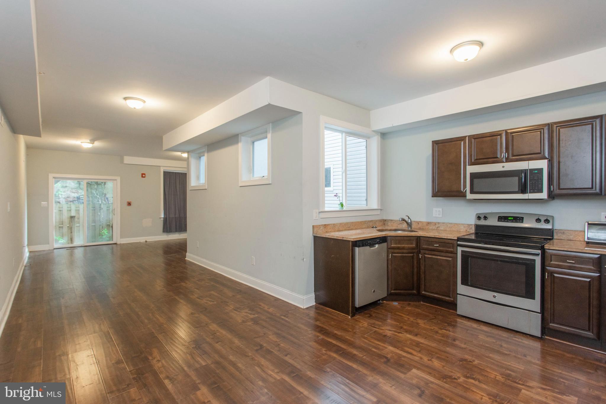 a kitchen with stainless steel appliances granite countertop a stove and a sink