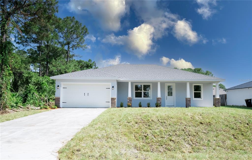 a view of a house with a yard