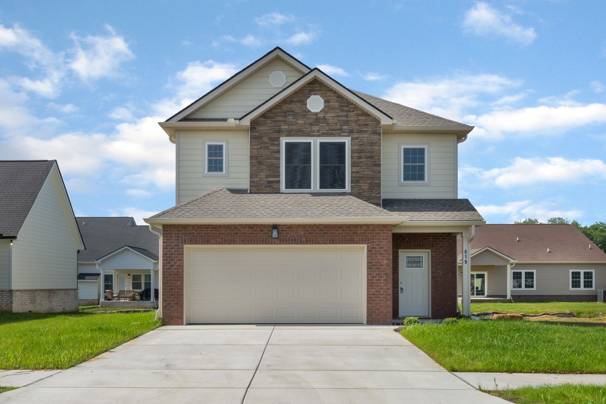 a front view of a house with a yard