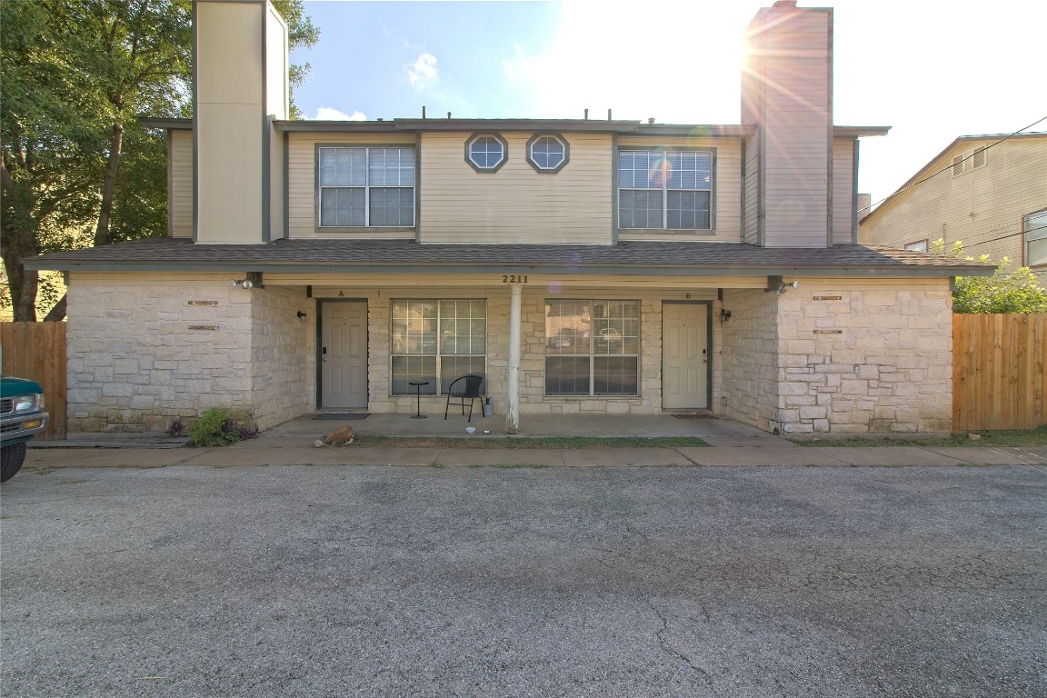 a view of a house with a parking area