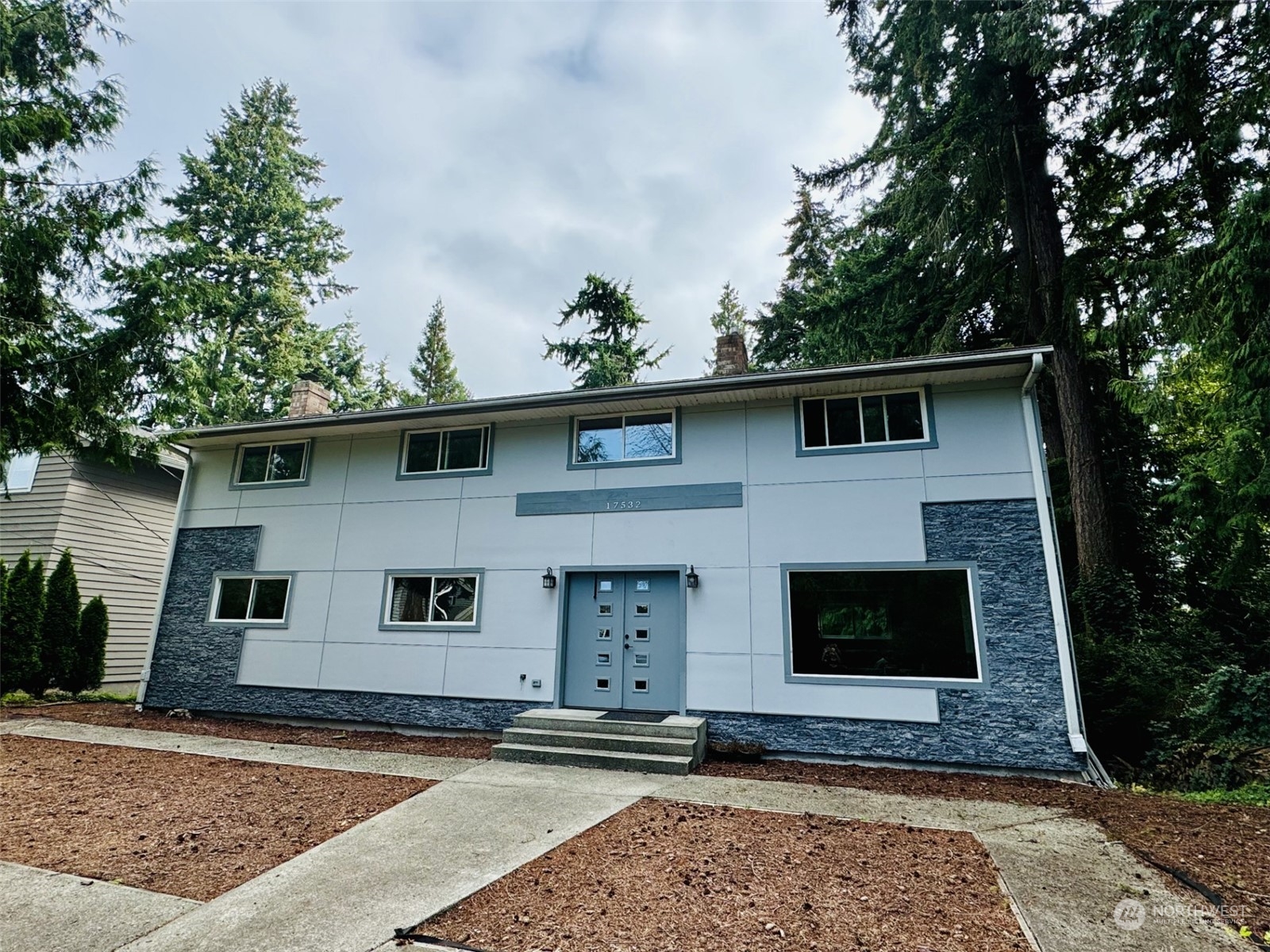 a front view of a house with garden