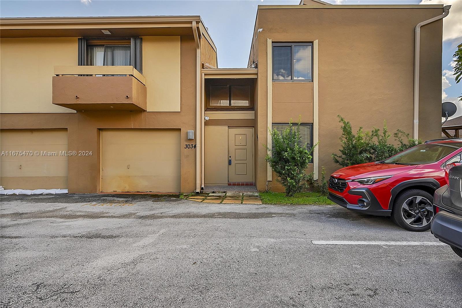 a car parked in front of a house