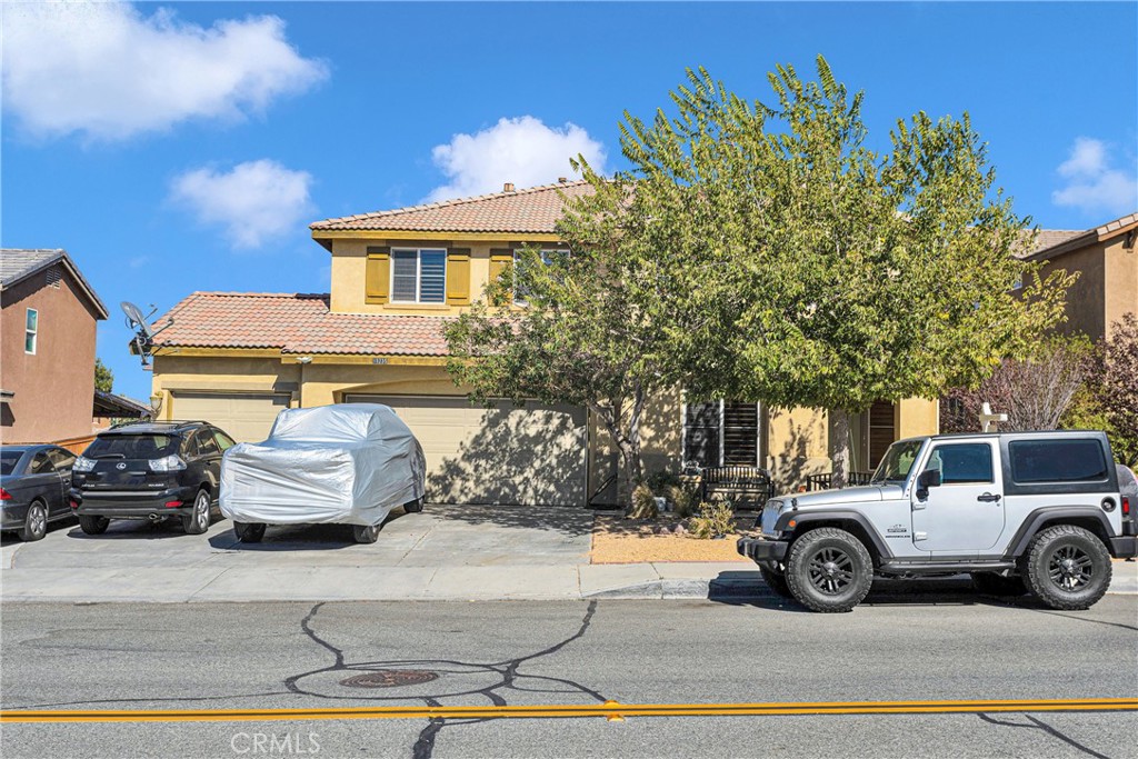 a view of a car parked in front of a house