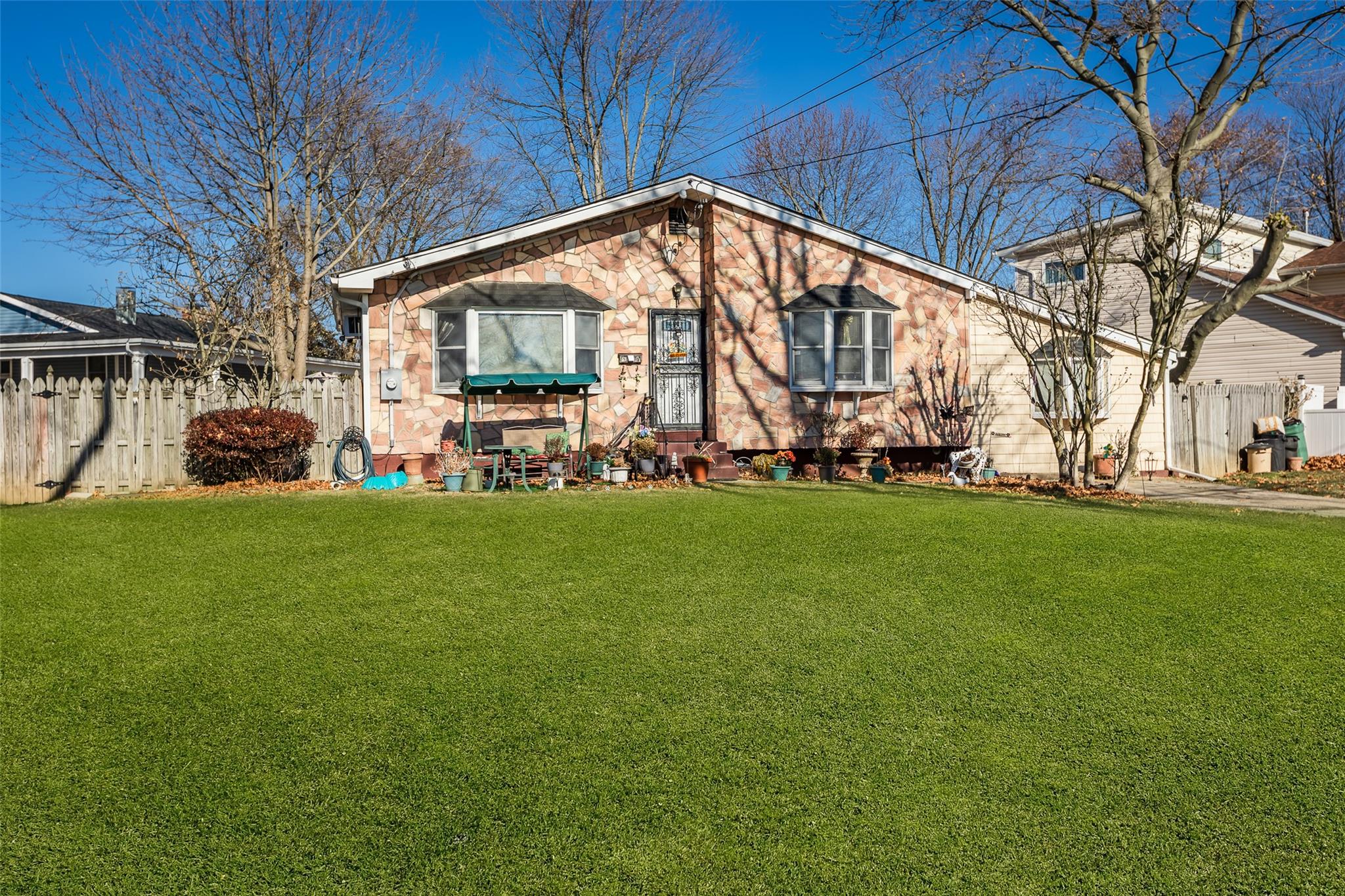 View of front of property with a front yard