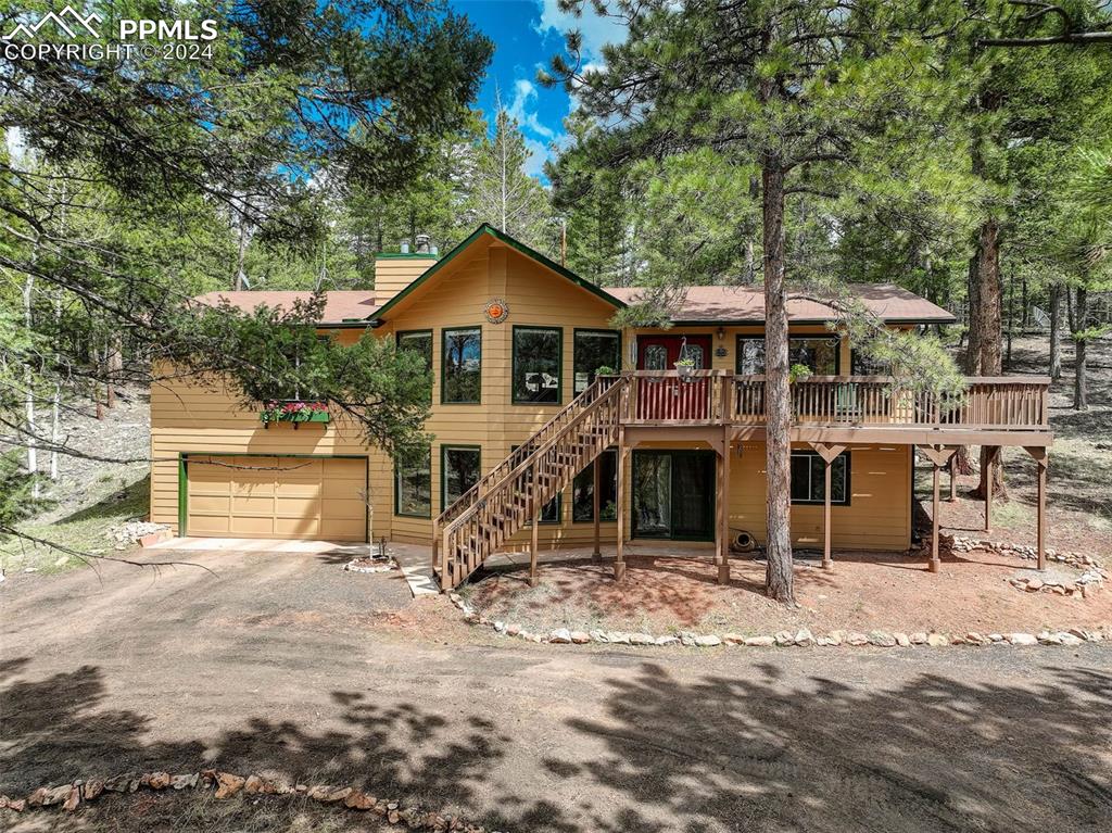 Beautiful Raised Ranch Style Home nestled in the trees