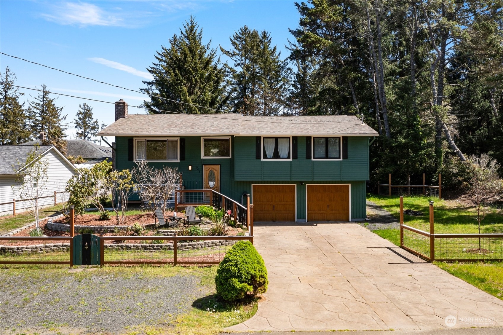 a front view of house with yard and green space