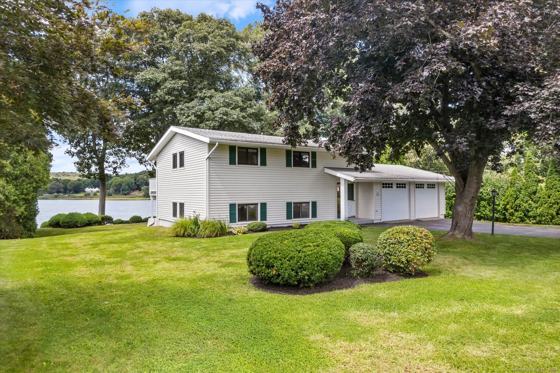 a view of a house with a backyard