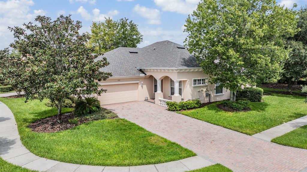 a view of a house with a backyard