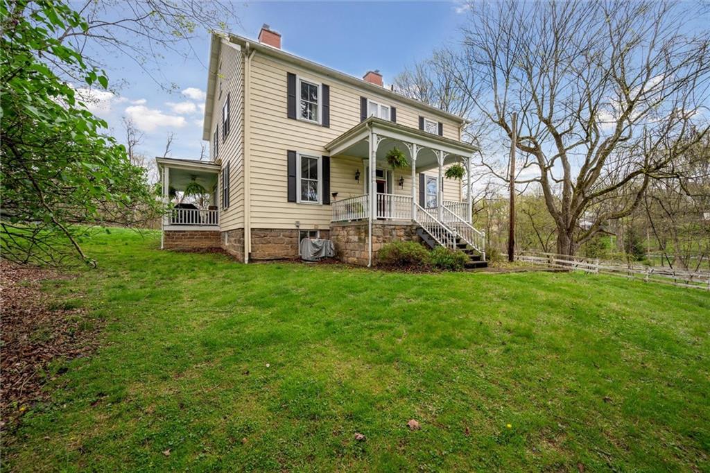 a view of a house with a yard