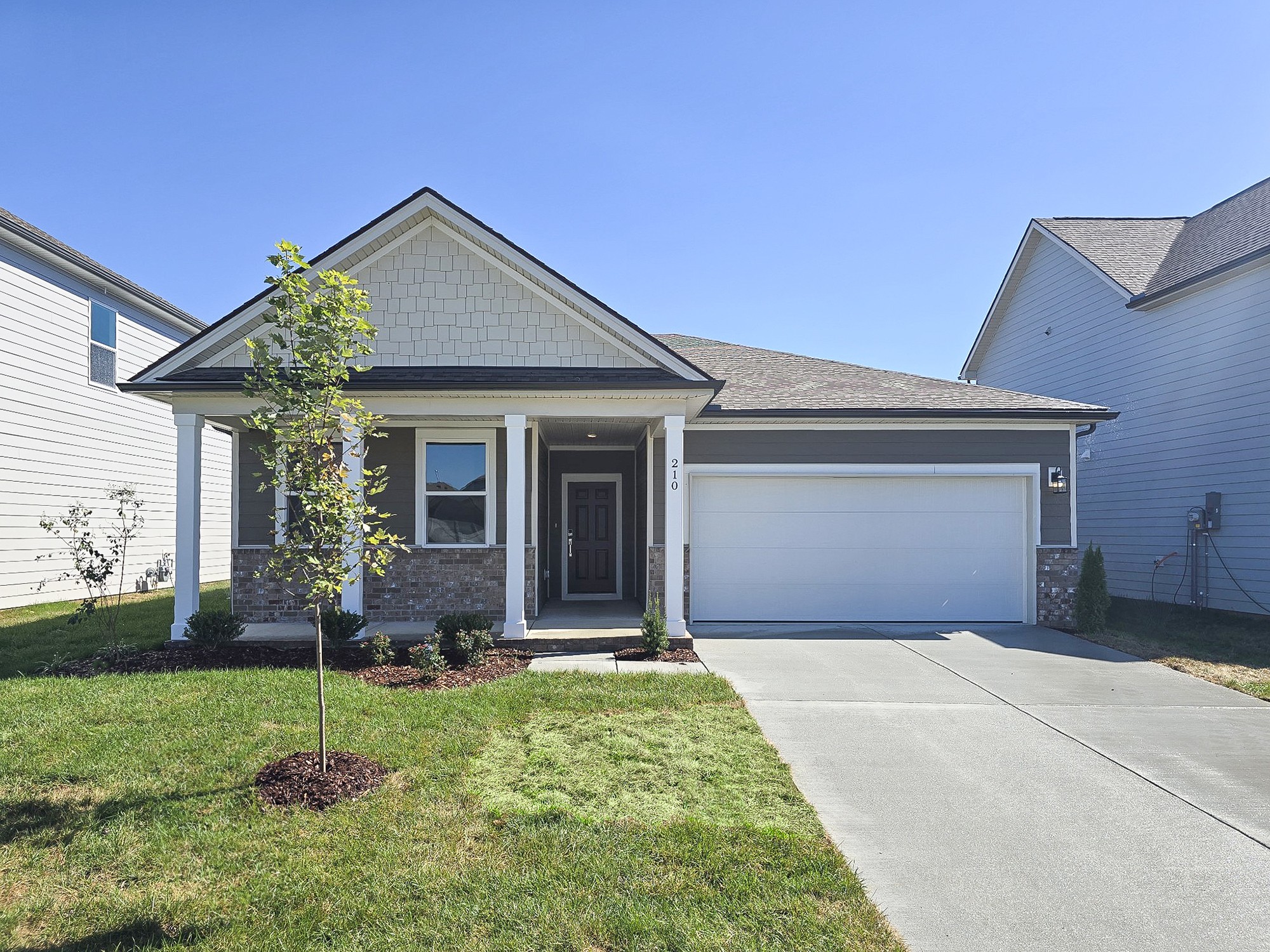 front view of a house with a yard