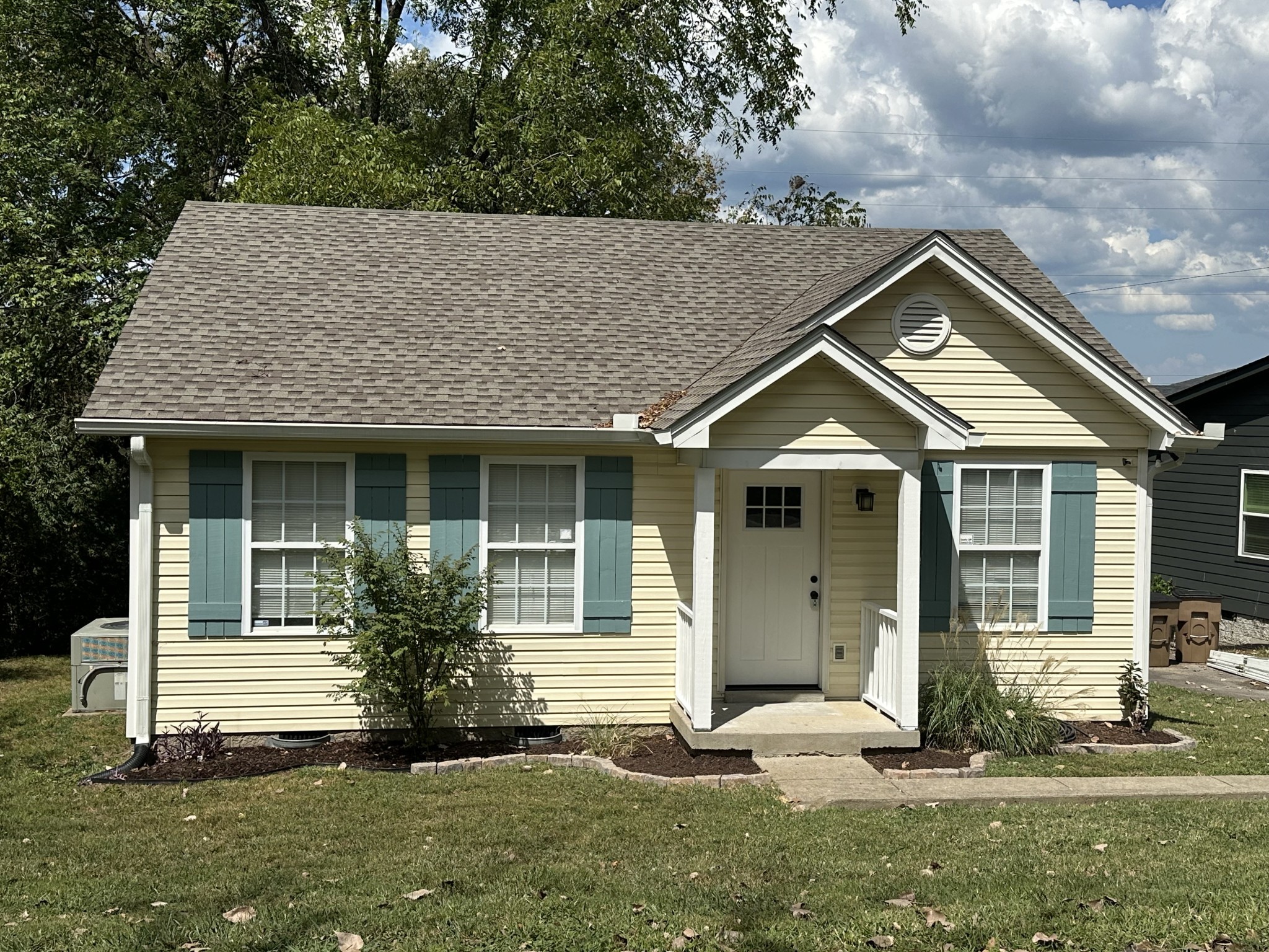 a front view of a house with a yard