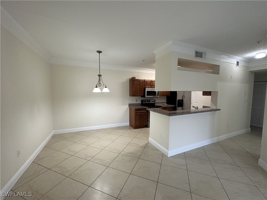 a kitchen with a sink and a stove top oven