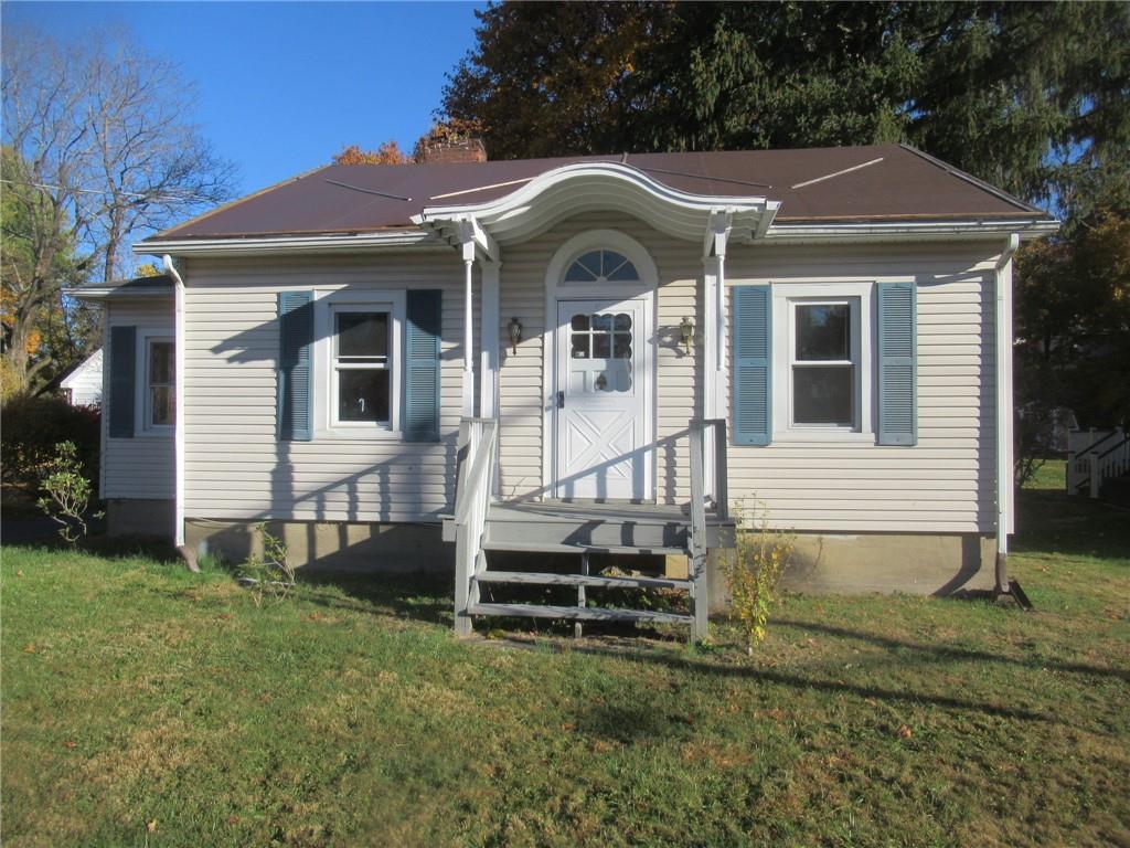 View of front of property with a front lawn