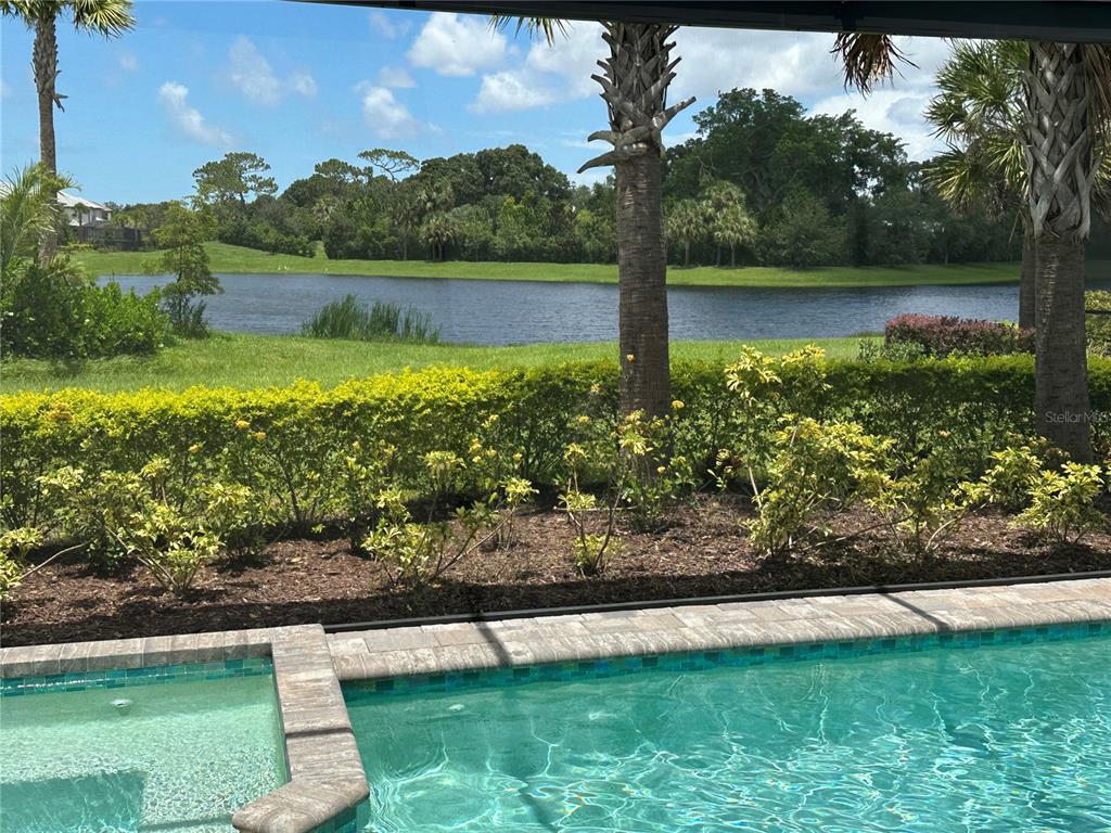 a view of a lake with a house in the background