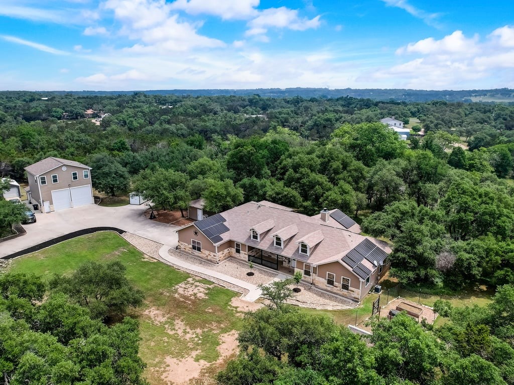 an aerial view of a house with garden