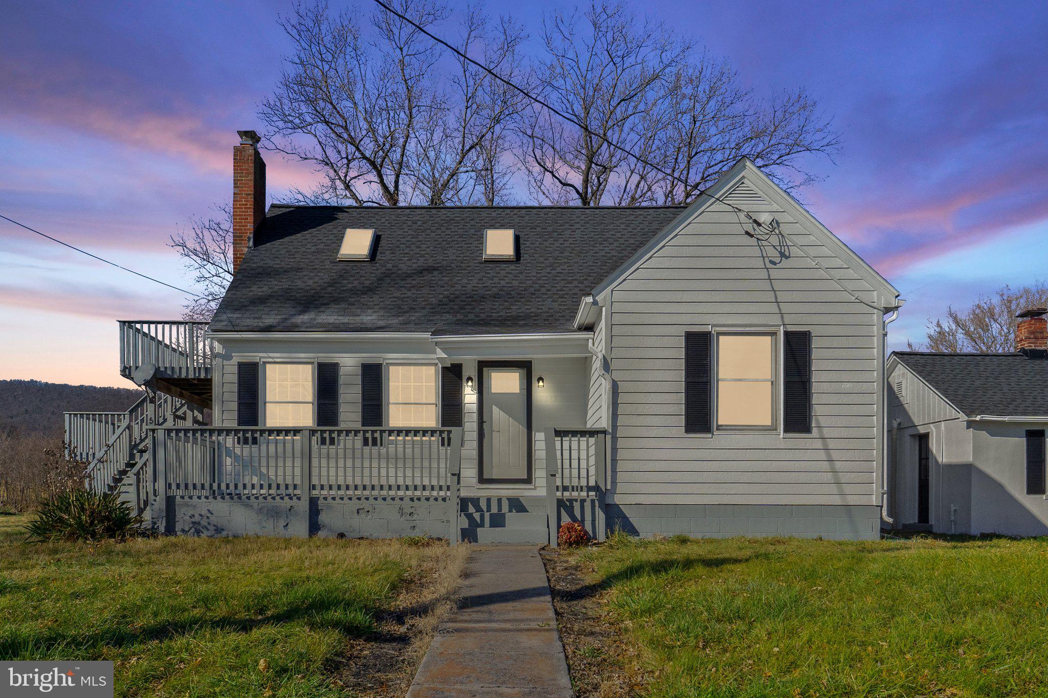 a view of house with backyard