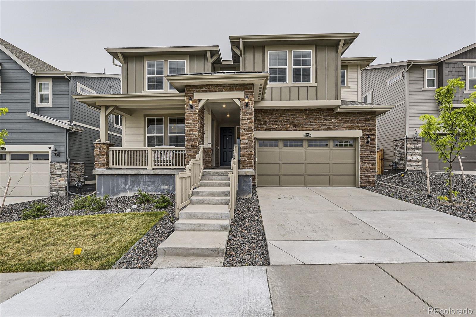 a front view of a house with a garage