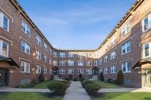 a view of a building with a yard