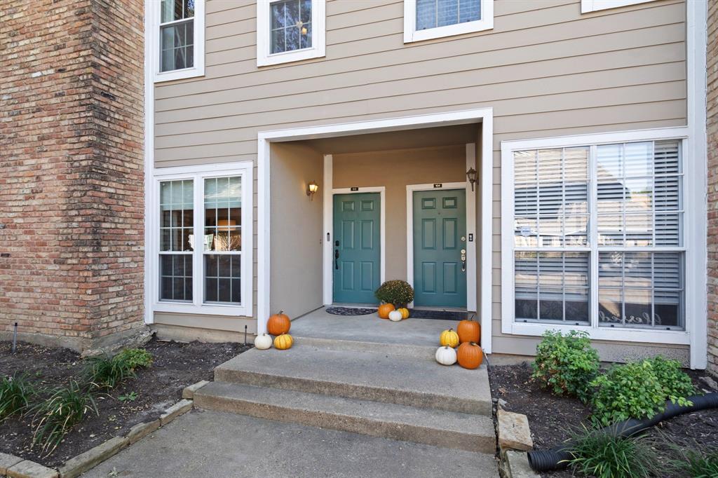 a front view of a house with outdoor seating