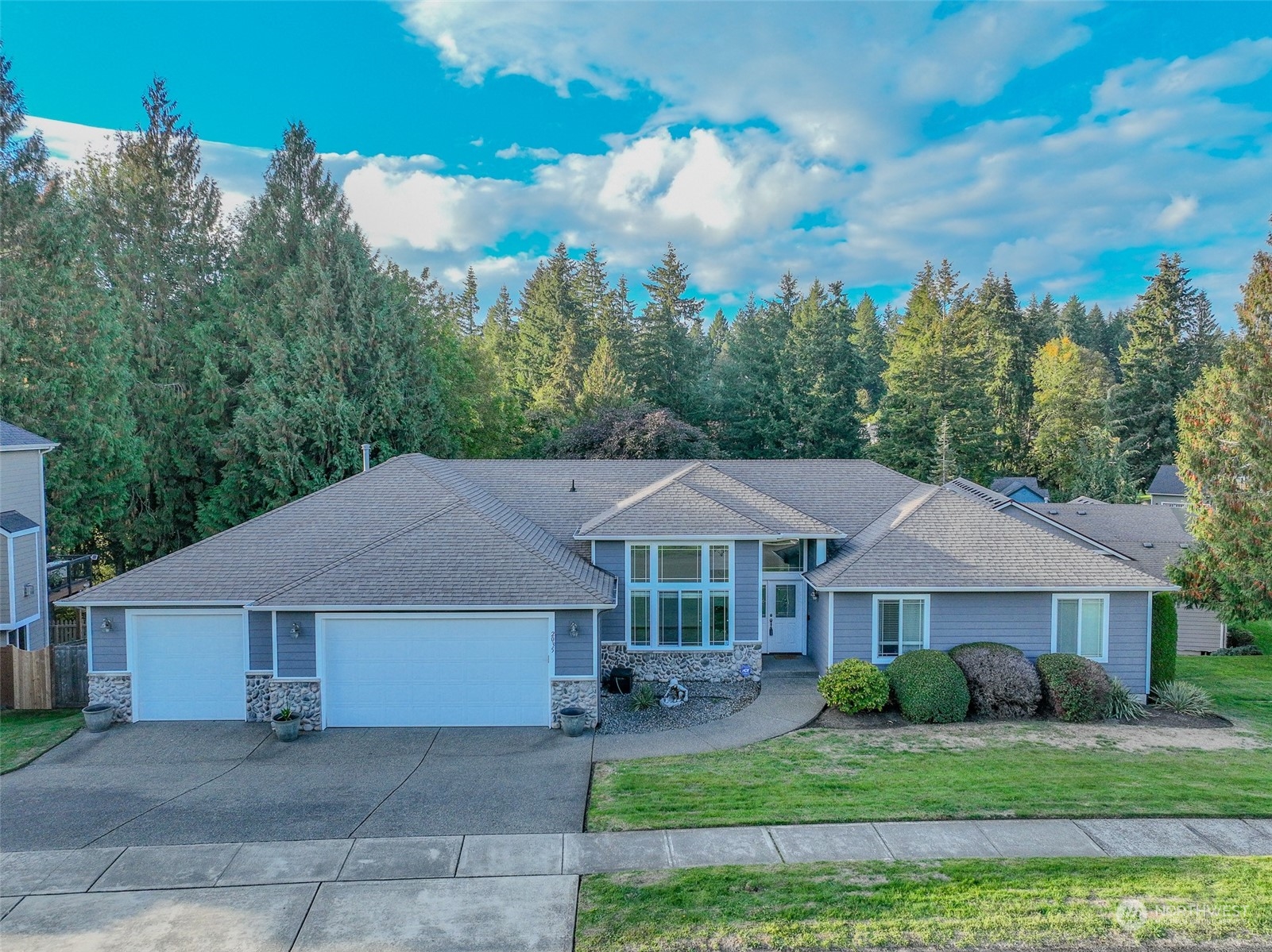 front view of a house with a yard