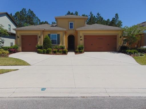 a front view of a house with yard