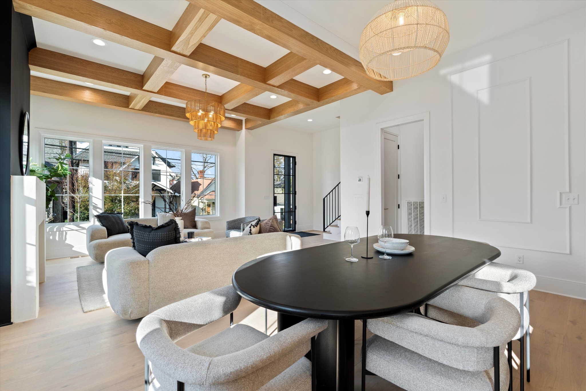 a view of a dining room with furniture and chandelier