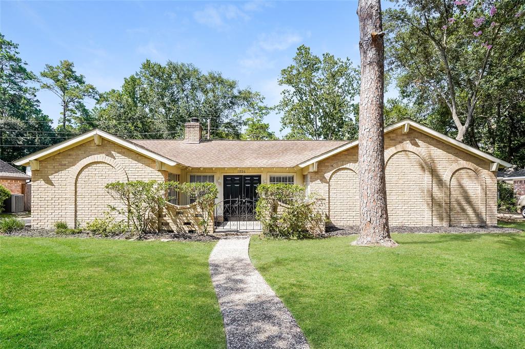 a front view of house with garden