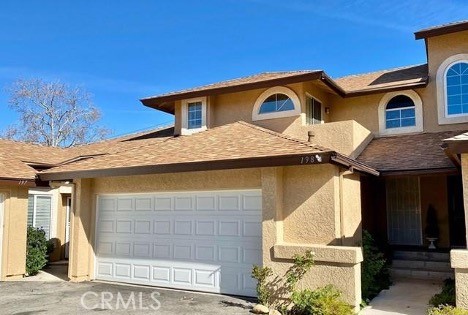 a front view of a house with a garage